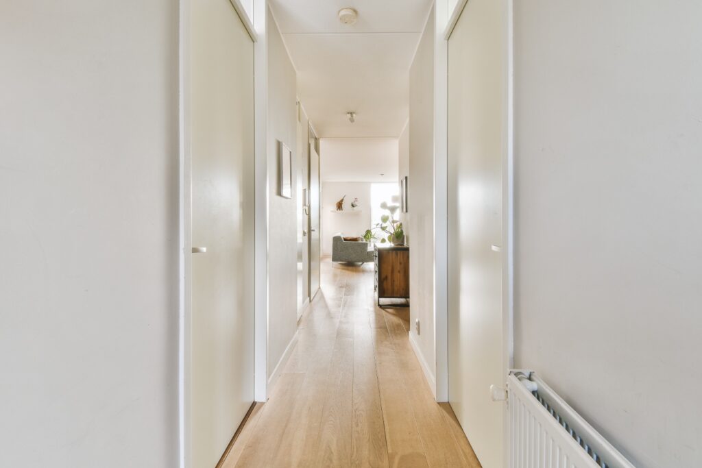 Narrow corridor with white walls